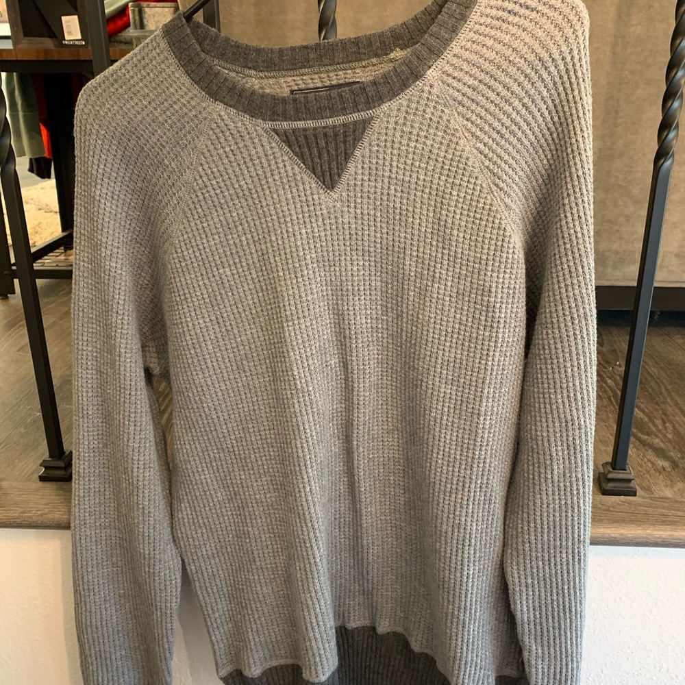 Grey waffle knit sweater.